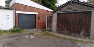 Image of the garage and way towards the gate